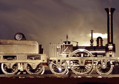 A miniature Adler locomotive with tender attached.