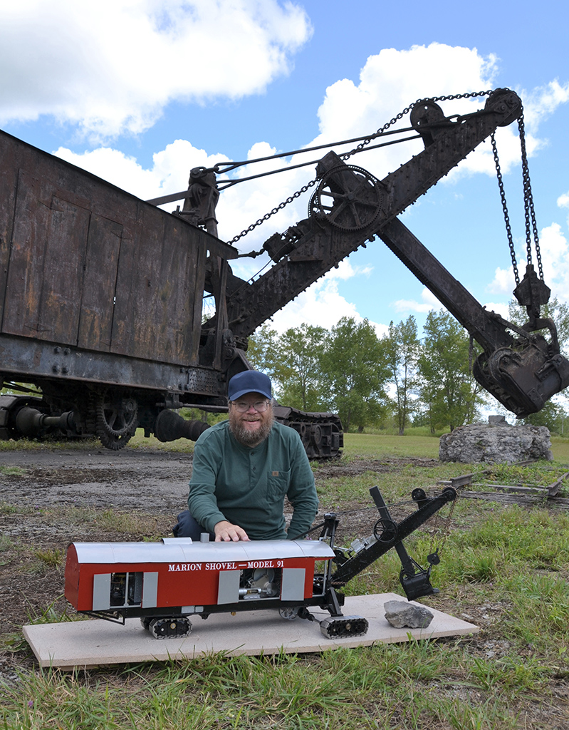 Chris with both his scale model Marion steam shovel and the real thing. 