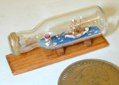 An extremely tiny ship in a bottle.