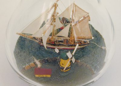 A side view of the ship in a bottle.