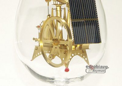 A miniature brass beam engine.