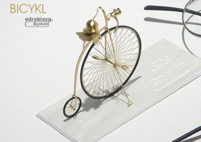 A tiny model of one of the first known bicycles.