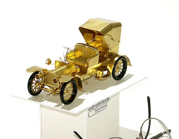 Szymon's miniature brass model of a Mercedes Simplex. 