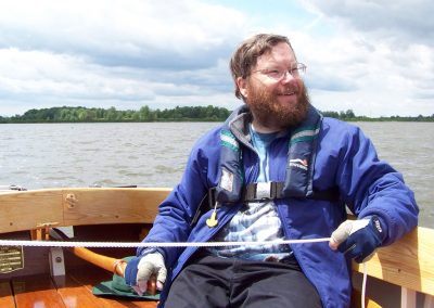 Chris at the helm of his Catboat.