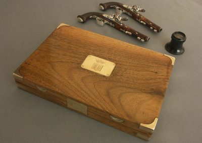 Michel's miniature dueling pistol set, and their walnut case.