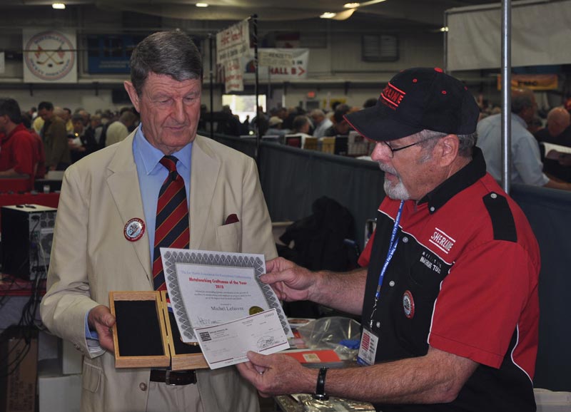 Michel Lefaivre (left) receiving his award for Craftsman of the Year in 2010.
