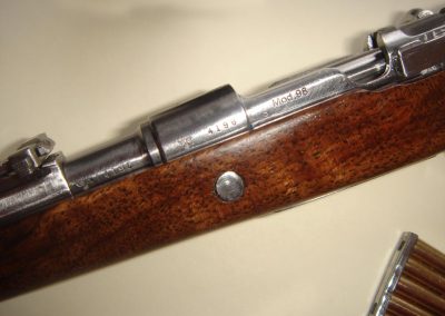 A close view of the miniature Mauser rifle.