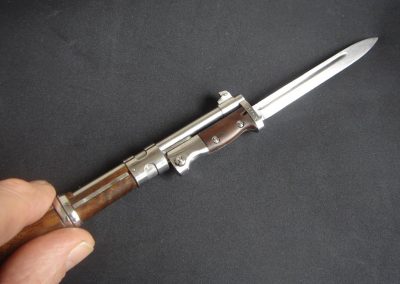 A close view of the miniature Mauser with bayonet attached.