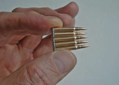 The miniature clip for the Mauser rifle ammunition.