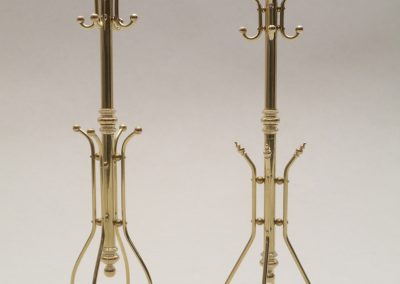 Two brass hall tree coat racks in miniature.