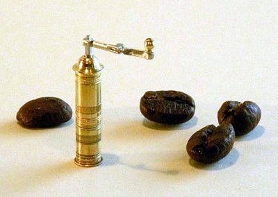 The miniature coffee grinder.
