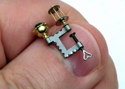 A tiny scale sewing clamp.