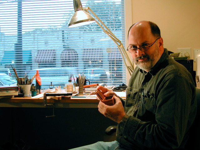 William Robertson at work on one of his fine scale miniatures.