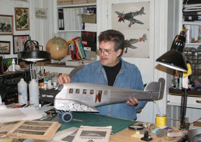 Mr. Rojas-Bazan at work on the Junkers fuselage in his model studio.