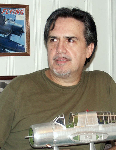 Guillermo Rojas-Bazan with one of his fine scale models.