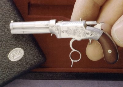 The Smith & Wesson Volcanic pistol in cocked position.
