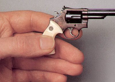 A miniature Colt New Century Model military revolver with ivory grips.
