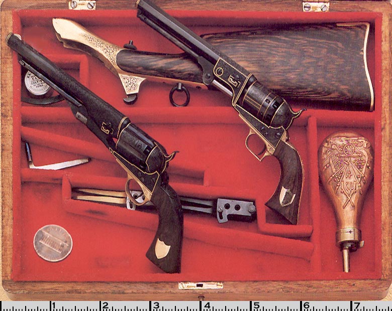A cased set of Colt Pistols in 1/3 scale.