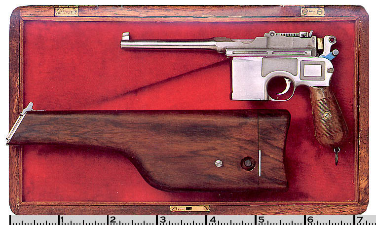 A miniature Mauser with detachable wooden shoulder stock in its display box. 