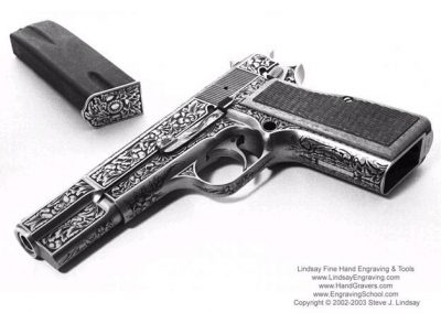 A handgun fully engraved by Steve.