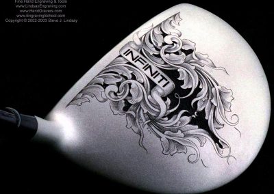 A metal golf club driver with Steve’s engraved design.