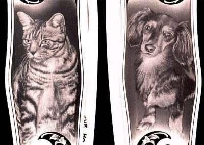 A close-up of the dog and cat engraving.
