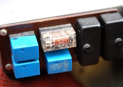 A closer view of the electrical relays on the dash.