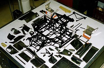 The tube frame and other components of the Ferrari.