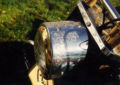 This black and gold Cushman “Golden Eagle” is lovingly adorned with engraved designs.