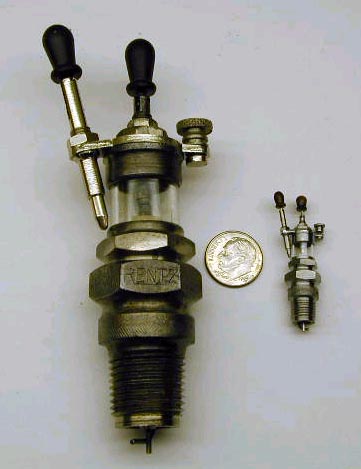 A scale model Rentz spark plug with the full-size part.