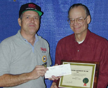 George Luhrs (right) accepting his Craftsman of the Year Award for 2001.