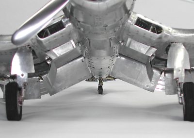 A front view of the landing gear and underside of the plane.
