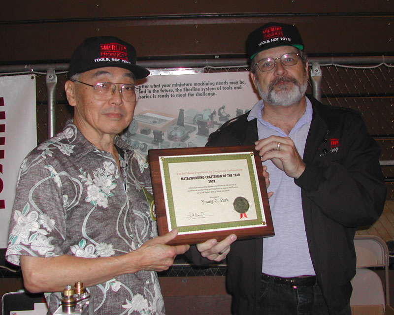 Young Park (left) accepting his Craftsman of the Year Award.