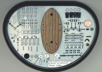 The display base containing all the component parts of the four-cylinder engine.