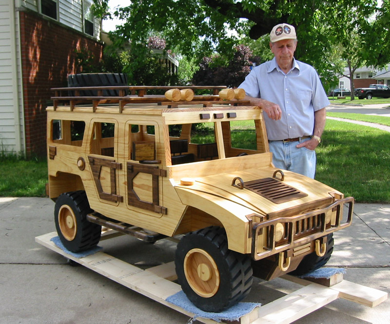 Chuck with his scale model wooden Hummer. 