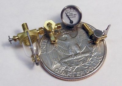 Tiny components for the miniature John Deere tractor.