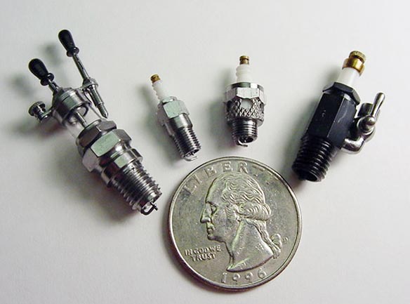 Four different scale spark plugs made by Jerry.