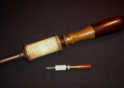 An Erlandsen ivory spool bow drill, both full-size and miniature.