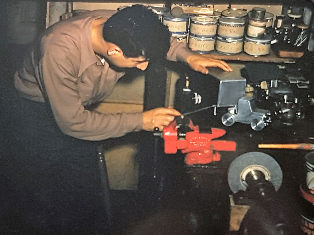 A young Abe at work in his home shop.