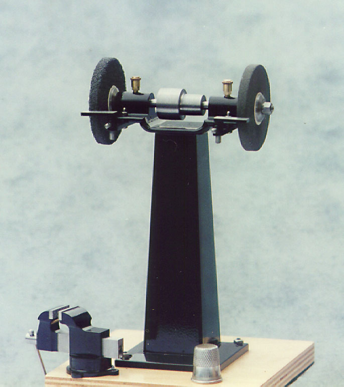 A 1/6 scale pedestal grinder and bench vise. 