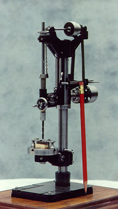 A miniature drill press typical of the era.