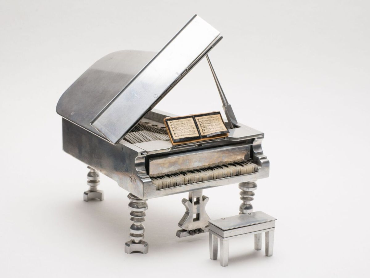 Abraham's miniature aluminum grand piano music box. 