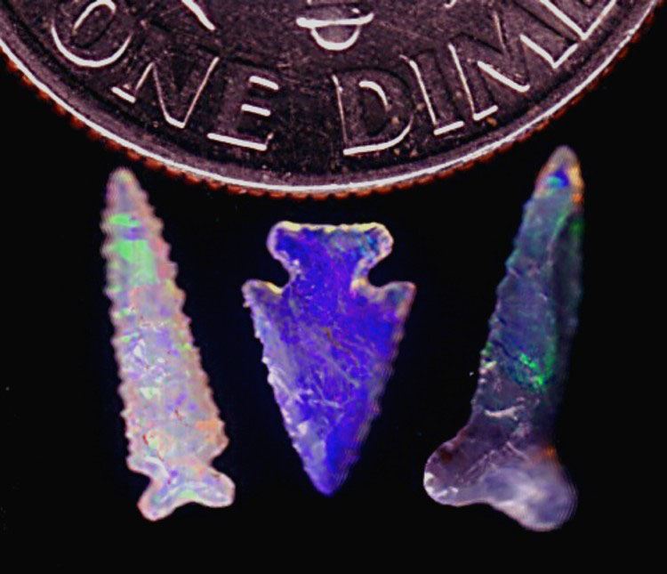 Three opal micro arrowheads.
