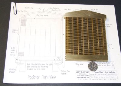 The full radiator assembly placed on a set of plans.