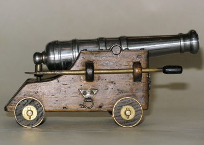A miniature steel naval cannon.