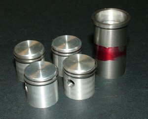 Ron’s finished pistons with rings, plus an extra sleeve and piston.