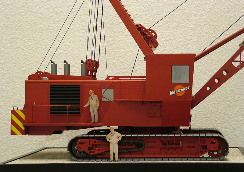 Scaled down photos of Larry occupy the miniature crane.