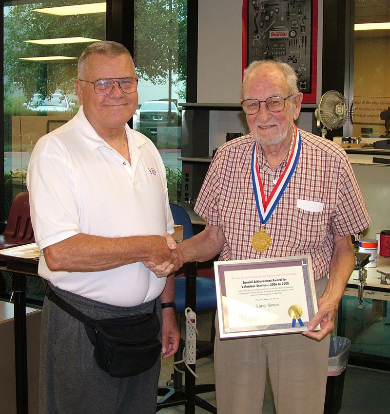 Joe Martin (left) presented Larry with a special recognition award for his volunteer work.