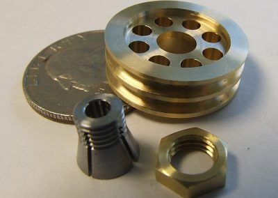 The oil pump pulley, collet, and nut.