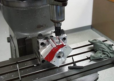A boring tool brings the cylinder holes to size.